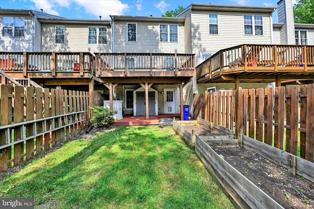 6119 Starburn Path, Columbia, MD 21045 - rear view of house featuring a garden, a wooden deck, and a fenced backyard