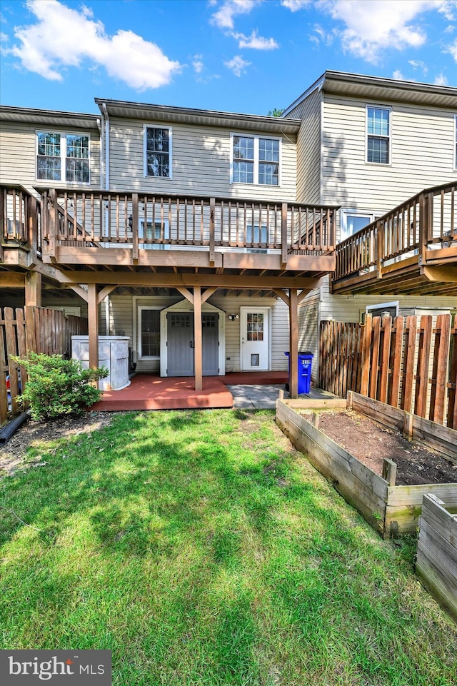 6119 Starburn Path, Columbia, MD 21045 - back of house with a vegetable garden and a deck