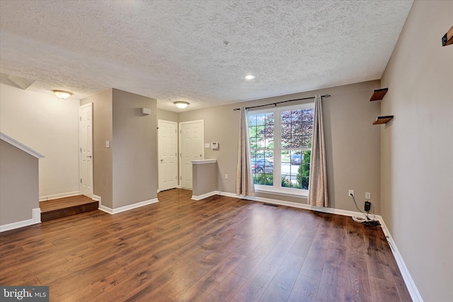 6119 Starburn Path, Columbia, MD 21045 - unfurnished living room with a textured ceiling and wood finished floors
