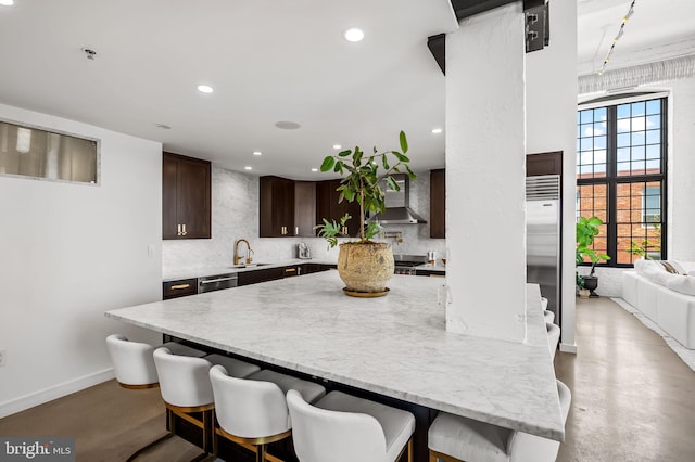 1220 Bank St Unit 304, Baltimore, MD 21202 - kitchen featuring wall chimney exhaust hood, concrete flooring, appliances with stainless steel finishes, a sink, and recessed lighting