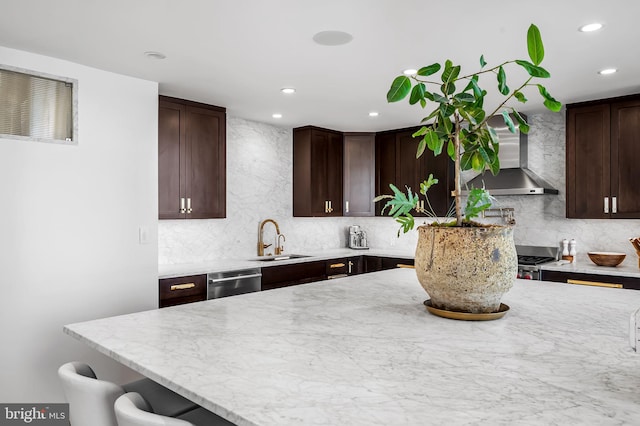 1220 Bank St Unit 304, Baltimore, MD 21202 - kitchen with wall chimney exhaust hood, a sink, stainless steel dishwasher, dark brown cabinets, and recessed lighting