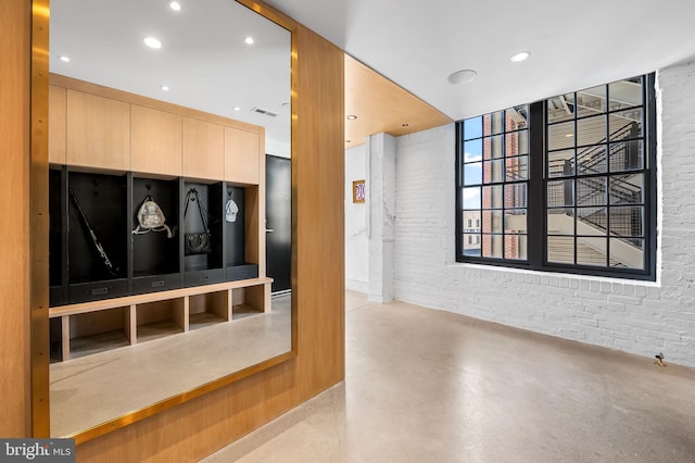 1220 Bank St Unit 304, Baltimore, MD 21202 - community lobby featuring brick wall and recessed lighting