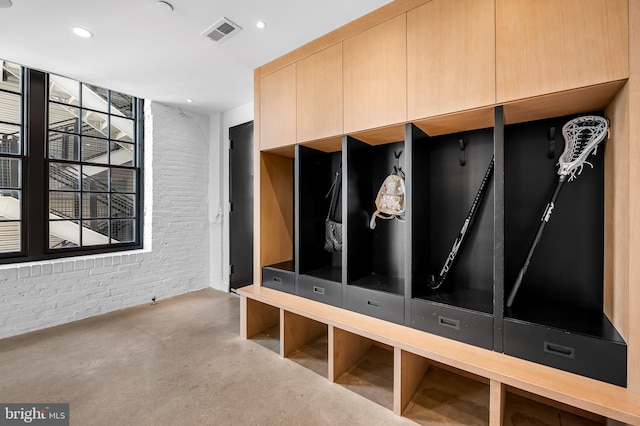 1220 Bank St Unit 304, Baltimore, MD 21202 - mudroom featuring brick wall, concrete flooring, and recessed lighting