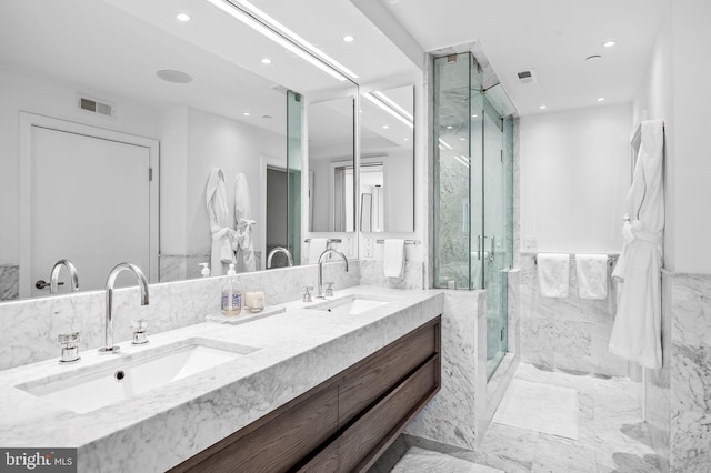 1220 Bank St Unit 304, Baltimore, MD 21202 - bathroom with tile walls, recessed lighting, a marble finish shower, double vanity, and marble finish flooring