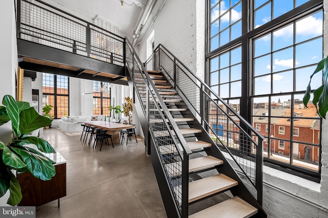 1220 Bank St Unit 304, Baltimore, MD 21202 - stairs with a high ceiling and concrete floors