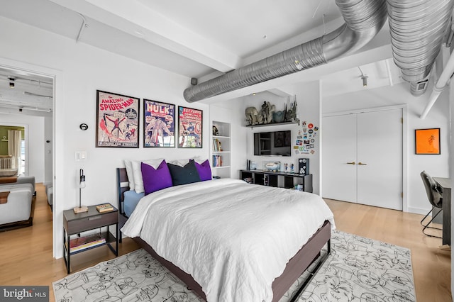 1220 Bank St Unit 304, Baltimore, MD 21202 - bedroom featuring light wood finished floors, a closet, and beam ceiling
