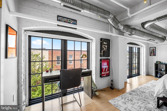 1220 Bank St Unit 304, Baltimore, MD 21202 - bedroom featuring multiple windows and wood finished floors