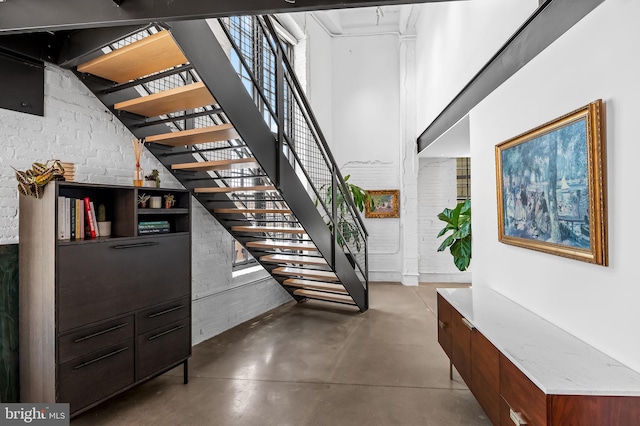 1220 Bank St Unit 304, Baltimore, MD 21202 - stairs featuring finished concrete floors and a towering ceiling