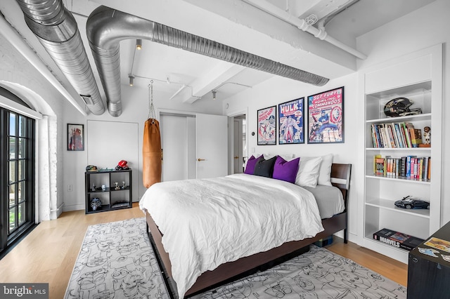 1220 Bank St Unit 304, Baltimore, MD 21202 - bedroom featuring multiple windows and wood finished floors