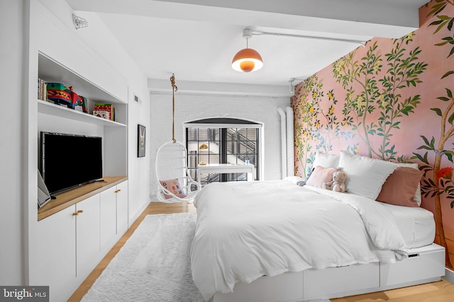1220 Bank St Unit 304, Baltimore, MD 21202 - bedroom featuring light wood finished floors and wallpapered walls