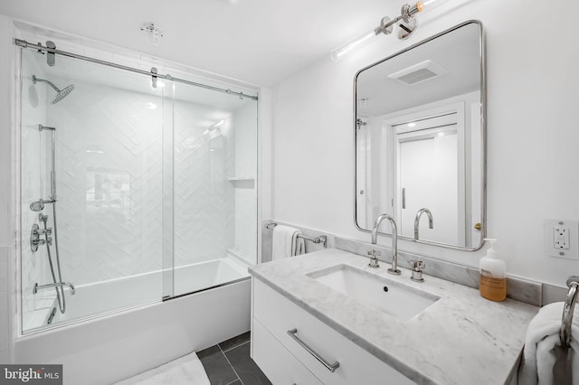 1220 Bank St Unit 304, Baltimore, MD 21202 - full bathroom featuring vanity, combined bath / shower with glass door, and tile patterned flooring