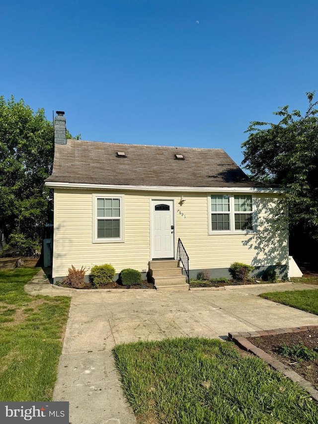 7821 Wendover Ave, Baltimore, MD 21234 - view of front of property with entry steps, a chimney, and a patio