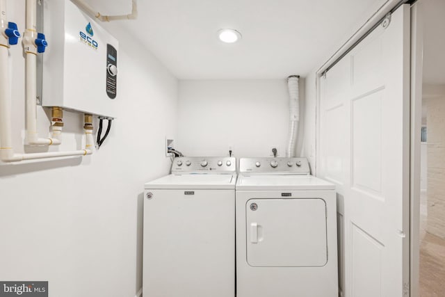 7821 Wendover Ave, Baltimore, MD 21234 - laundry area with washer and dryer and water heater