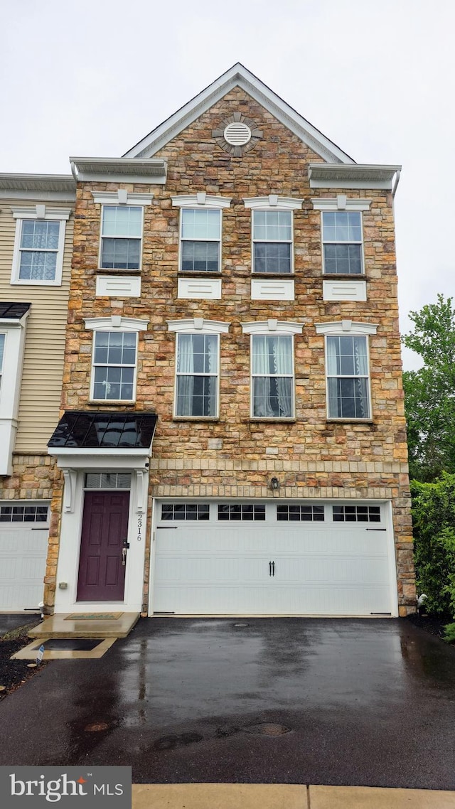 2316 Macis Cir, Warrington, PA 18976 - view of front facade featuring stone siding, asphalt driveway, and a garage