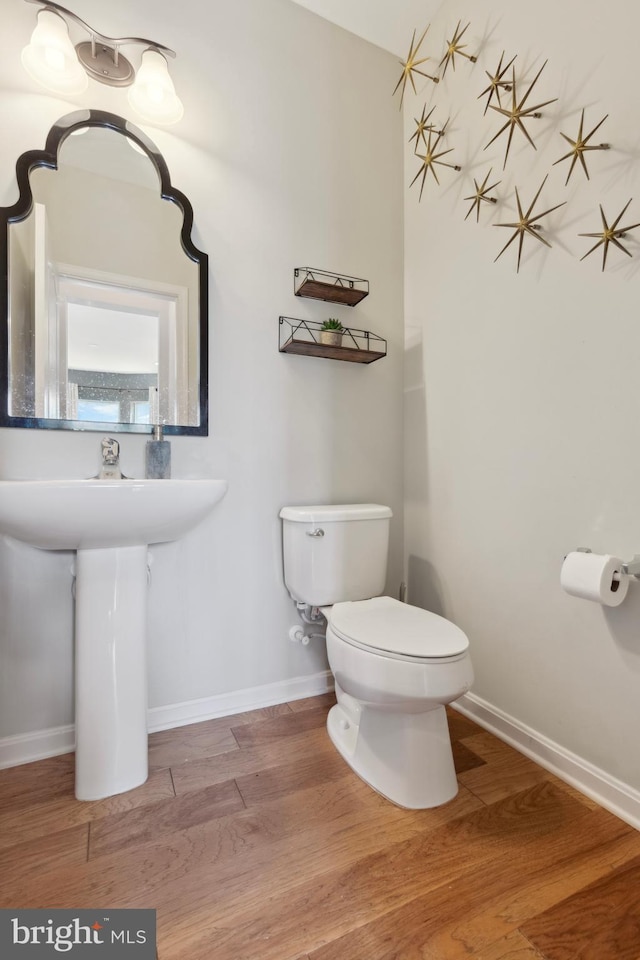 2316 Macis Cir, Warrington, PA 18976 - half bathroom with wood finished floors, toilet, baseboards, and a sink