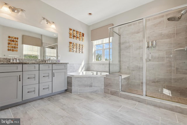 2316 Macis Cir, Warrington, PA 18976 - full bathroom featuring double vanity, a shower stall, a garden tub, and tile patterned flooring