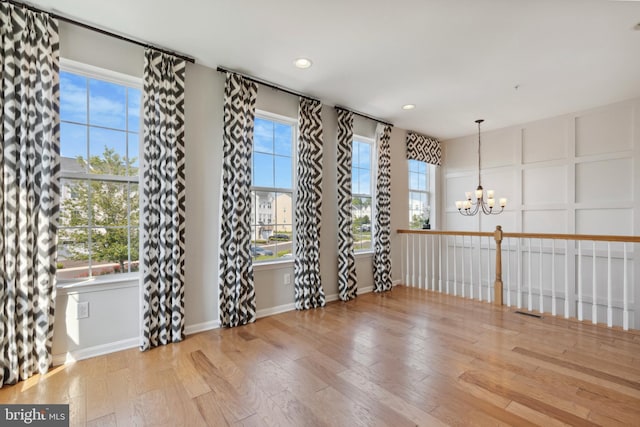 2316 Macis Cir, Warrington, PA 18976 - empty room featuring a chandelier, wood finished floors, plenty of natural light, recessed lighting, and baseboards