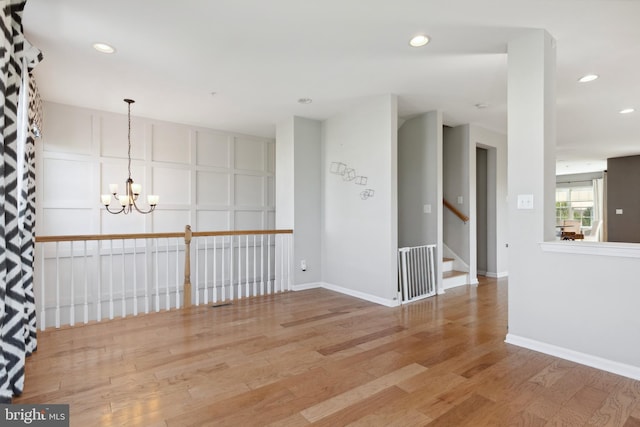 2316 Macis Cir, Warrington, PA 18976 - unfurnished room featuring a chandelier, wood finished floors, recessed lighting, baseboards, and stairs