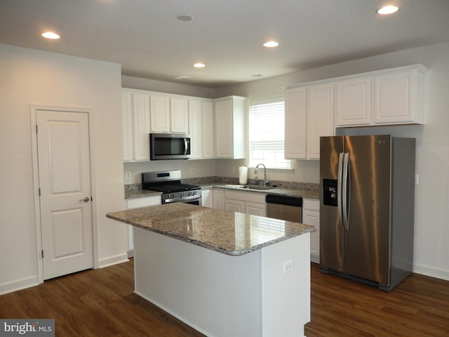 135 Olde Field Dr, Magnolia, DE 19962 - kitchen featuring appliances with stainless steel finishes, a sink, white cabinetry, dark wood-style flooring, and recessed lighting