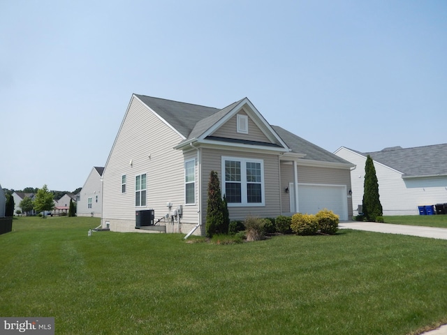 135 Olde Field Dr, Magnolia, DE 19962 - view of front facade with central AC, a front lawn, a garage, and concrete driveway
