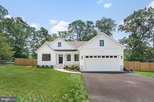209 S Camden Ave, Fruitland, MD 21826 - modern inspired farmhouse featuring driveway, a garage, roof with shingles, and stone siding