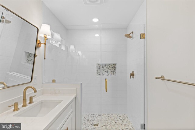 209 S Camden Ave, Fruitland, MD 21826 - bathroom featuring vanity, a shower stall, and recessed lighting