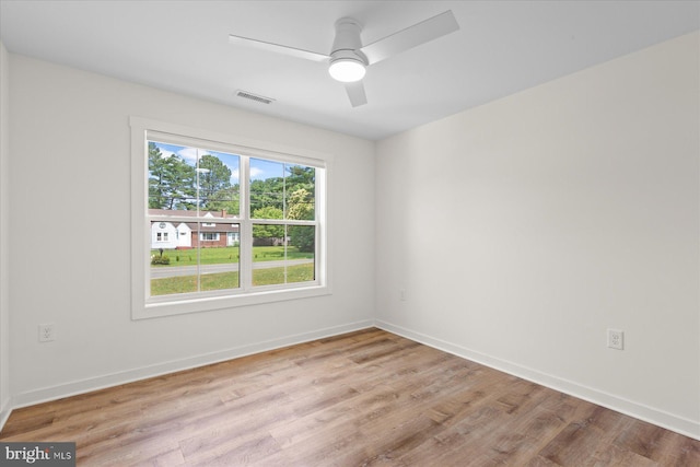209 S Camden Ave, Fruitland, MD 21826 - empty room with wood finished floors and a ceiling fan