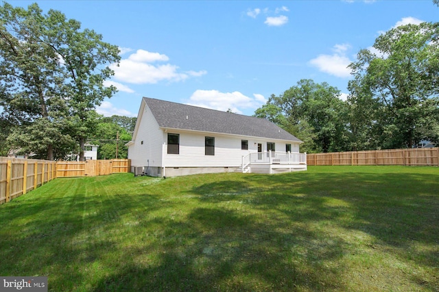 209 S Camden Ave, Fruitland, MD 21826 - rear view of house featuring a fenced backyard, a deck, and a shingled roof