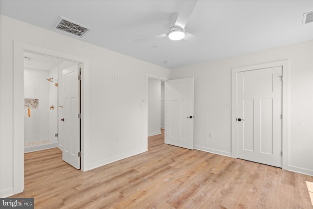 209 S Camden Ave, Fruitland, MD 21826 - unfurnished bedroom featuring light wood-style flooring, connected bathroom, and a ceiling fan
