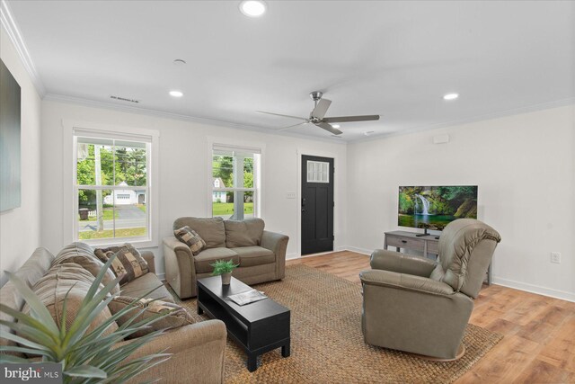 209 S Camden Ave, Fruitland, MD 21826 - living area featuring crown molding, wood finished floors, ceiling fan, and recessed lighting