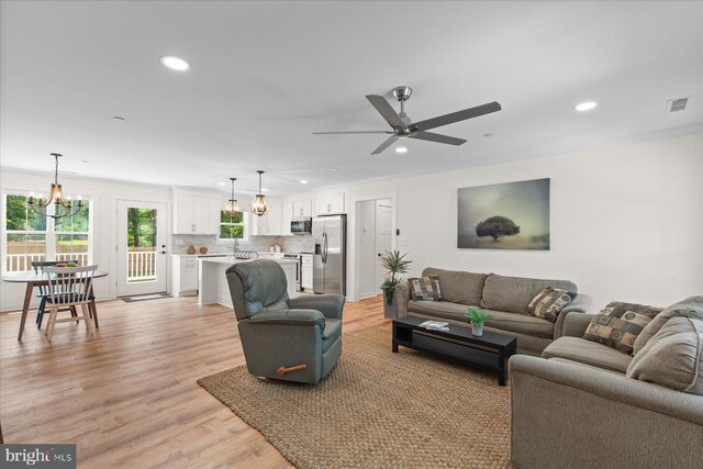 209 S Camden Ave, Fruitland, MD 21826 - living area featuring a chandelier, recessed lighting, light wood finished floors, and ceiling fan