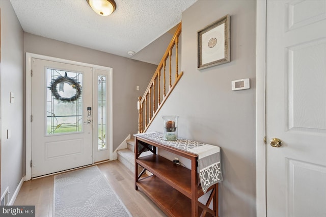 22 Buttonwood Pl, Swedesboro, NJ 08085 - entryway with stairway, light wood finished floors, a textured ceiling, and baseboards