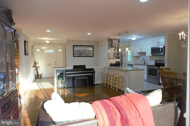 6403 Limerick Ct, Springfield, VA 22152 - living area featuring ornamental molding, wood finished floors, and recessed lighting