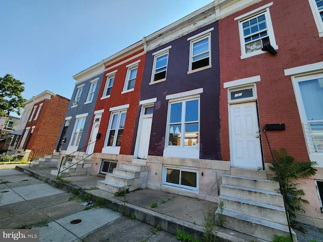 107 N Payson St, Baltimore, MD 21223 - multi unit property featuring entry steps and brick siding