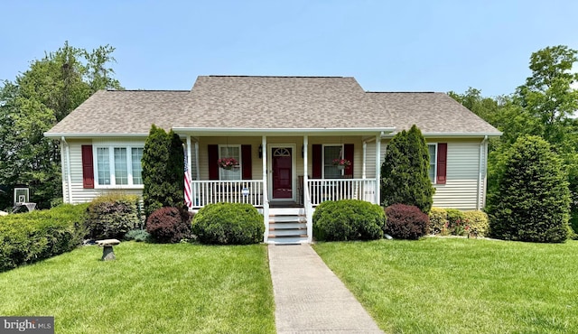 1688 W Commonwealth Dr, Front Royal, VA 22630 - cape cod house featuring covered porch, a front yard, and a shingled roof