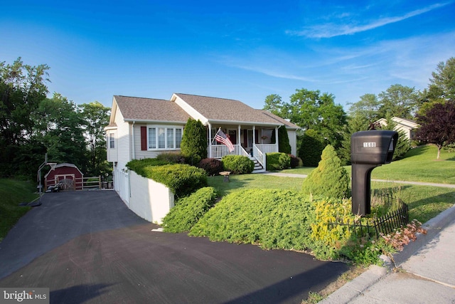 1688 W Commonwealth Dr, Front Royal, VA 22630 - ranch-style house featuring a porch, driveway, a front lawn, and an attached garage