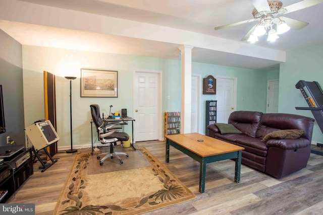 1688 W Commonwealth Dr, Front Royal, VA 22630 - living room featuring light wood-style flooring, ceiling fan, decorative columns, and baseboards