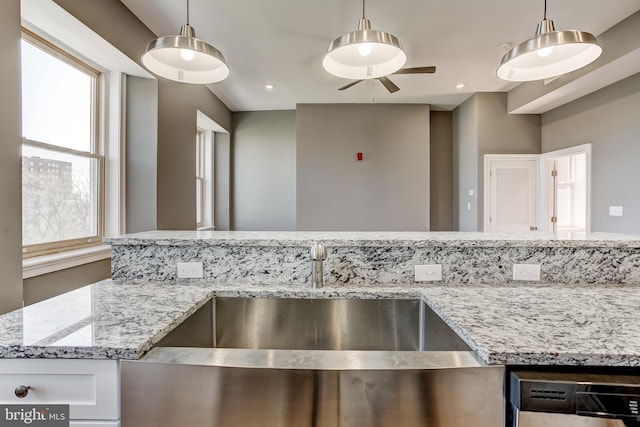 1214 Eutaw Pl, Baltimore, MD 21217 - kitchen with a sink, dishwasher, light stone countertops, a ceiling fan, and pendant lighting