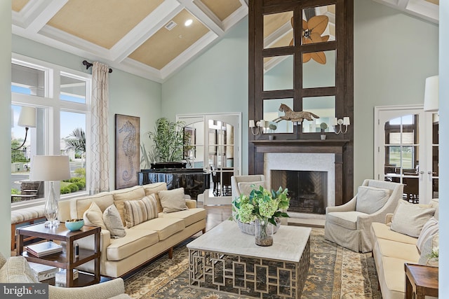 33584 Windswept Dr Unit 5202, Millsboro, DE 19966 - living area featuring high vaulted ceiling, french doors, a fireplace with raised hearth, beam ceiling, and ornamental molding
