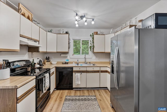 7 Sand Trap Ter, Palmyra, VA 22963 - kitchen featuring black appliances, under cabinet range hood, light countertops, white cabinets, and light wood-style floors