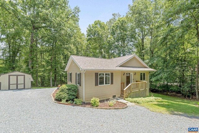 7 Sand Trap Ter, Palmyra, VA 22963 - view of front of house featuring a storage shed, roof with shingles, and driveway
