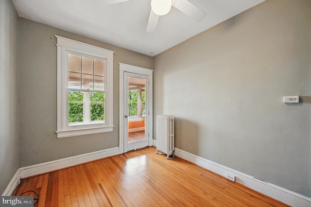 4210 3rd St NW, Washington, DC 20011 - empty room featuring radiator heating unit, baseboards, hardwood / wood-style flooring, and ceiling fan