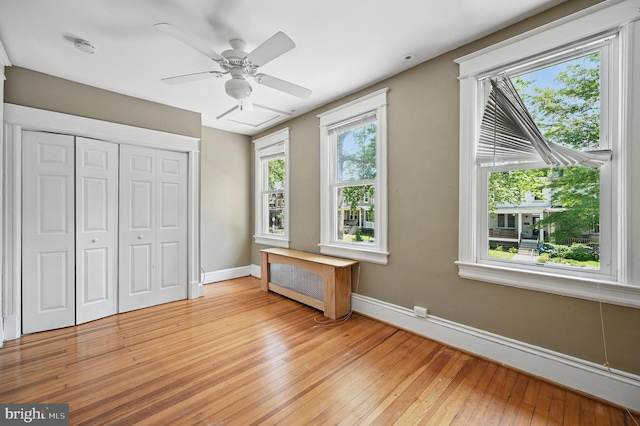 4210 3rd St NW, Washington, DC 20011 - unfurnished bedroom featuring baseboards, light wood-style flooring, a closet, and a ceiling fan