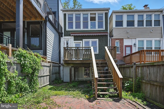 4210 3rd St NW, Washington, DC 20011 - rear view of house with a fenced backyard and stairway