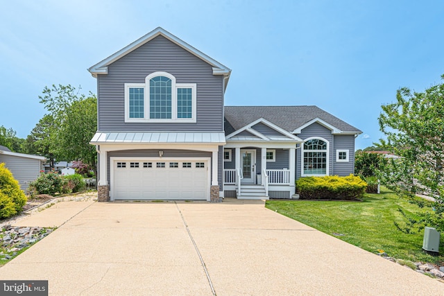 17 Clipper Ct, Ocean Pines, MD 21811 - traditional-style house with a porch, a garage, driveway, a front yard, and a standing seam roof