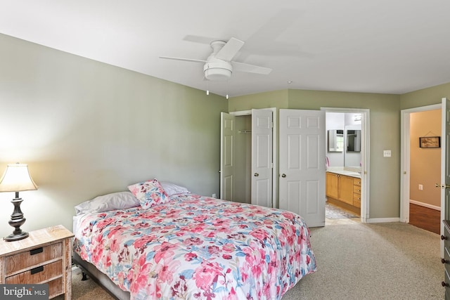 2504 Shelley Cir Unit 1B, Frederick, MD 21702 - bedroom with light colored carpet, ensuite bathroom, baseboards, and ceiling fan
