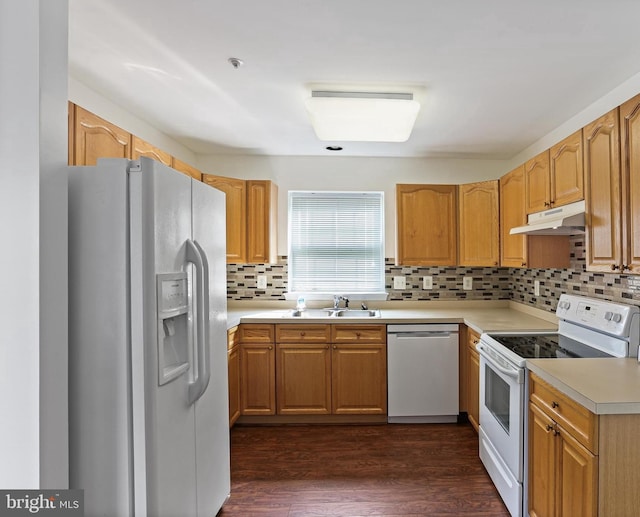 2504 Shelley Cir Unit 1B, Frederick, MD 21702 - kitchen featuring white appliances, a sink, under cabinet range hood, backsplash, and dark wood finished floors