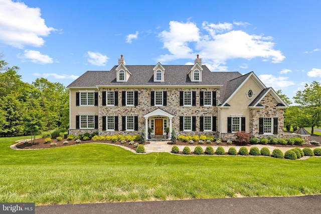 5835 Ridgeview Dr, Doylestown, PA 18902 - colonial inspired home featuring a chimney, stone siding, and a front yard
