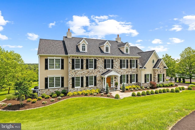 5835 Ridgeview Dr, Doylestown, PA 18902 - colonial house featuring stone siding, a front yard, and a chimney