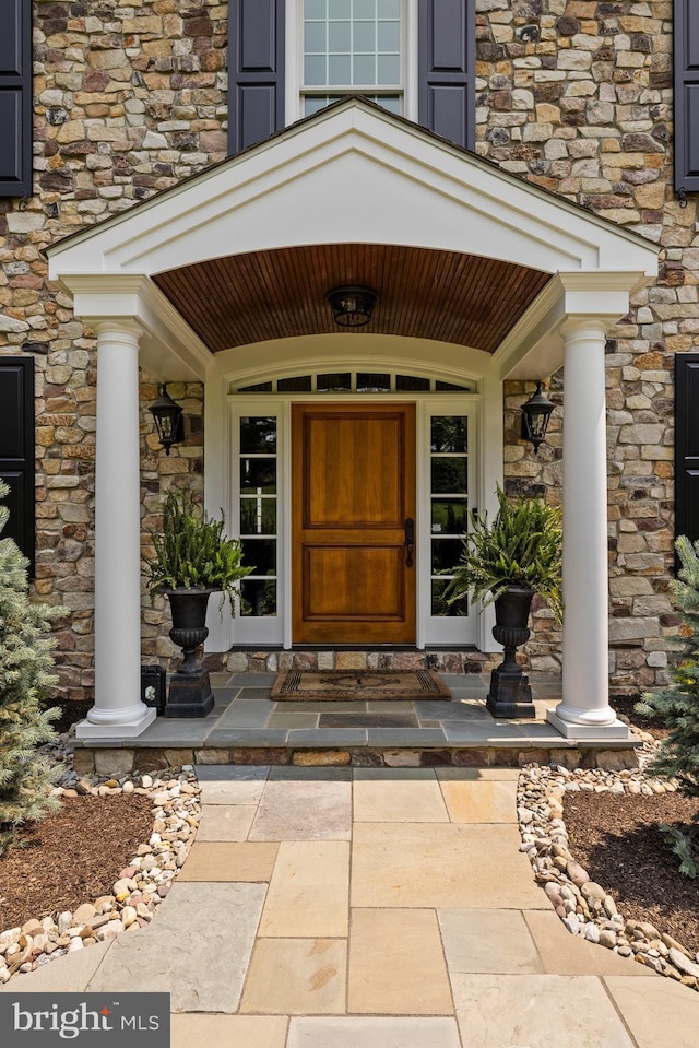 5835 Ridgeview Dr, Doylestown, PA 18902 - doorway to property with stone siding and a porch